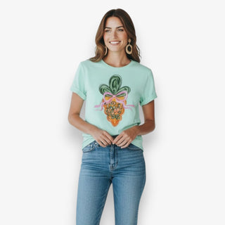 Woman wearing a light blue t-shirt with a colorful carrot design on a white background