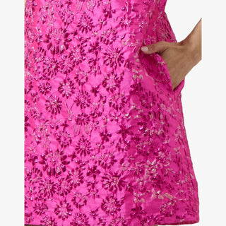 Fuchsia jacquard mini dress with puff sleeves, floral texture, and metallic shimmer for a bold, feminine statement look.