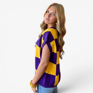 Purple and gold checkered game day sweater top with cap sleeves and relaxed fit, side view