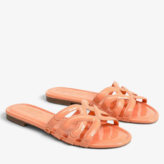     Pair of Circus NY by Sam Edelman Cat tangerine flat sandals with glossy cutout straps, top view