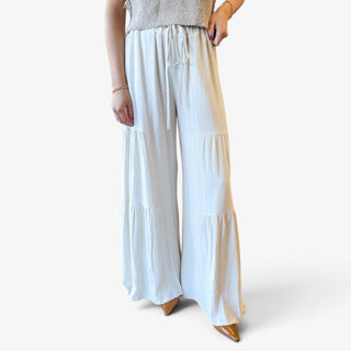 Coastal Linen Palazzo Pants in white with wide legs, tiered detailing and drawstring waist, front detail view for women