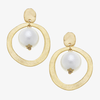 Gold hoop earrings with white pearls on a white background