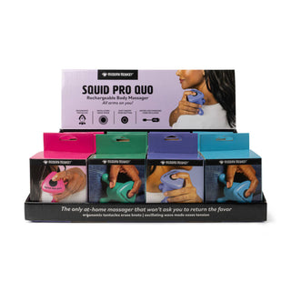 Display of Squid Pro Quo rechargeable body massager packaging with a woman using the product.
