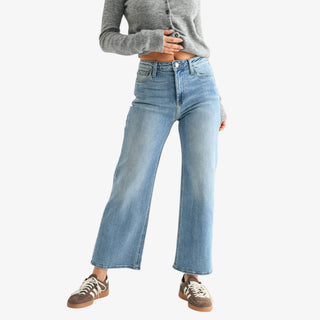 Slim wide leg jeans full length product view with wide leg silhouette and high rise fit styled with sneakers