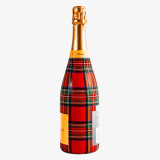 Bottle with a red and gold plaid design on a white background