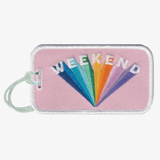 Pink embroidered Weekend luggage tag with rainbow lettering and white trim
