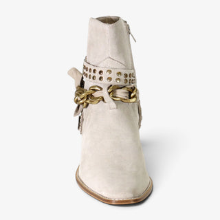 Diba True Paper Lily light taupe suede ankle boot showing pointed toe, gold chain and studded straps, front view