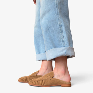  Dolce Vita Betzy suede loafer mule in camel shown from the side with open back, ruched suede upper and low heel.