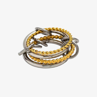 Gold and silver mixed metal interlocking ring set with beaded and twisted textures