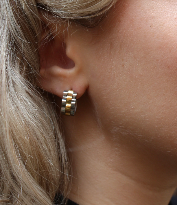 Mixed Metal Watchband Huggie Earrings featuring a sleek gold and silver blend for timeless chic.
