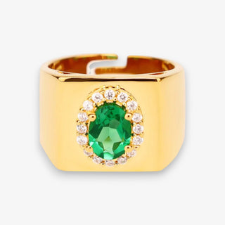 Gold ring with a green gemstone and small diamonds on a white background
