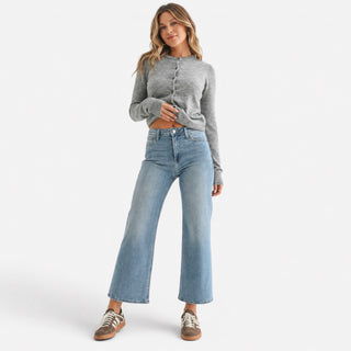 Medium wash cropped wide leg jeans with a high rise and relaxed leg shown in a full front outfit view