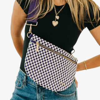 Pretty Simple Westlyn woven bum bag in purple and white check with adjustable purple strap and gold zipper styled on model, front view