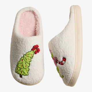 Whimsical Green Monster Slippers with pink sherpa lining and embroidered Christmas designs