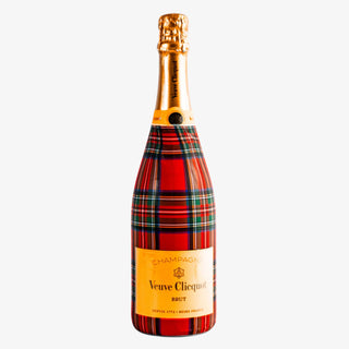 Veuve Clicquot champagne bottle with red and green plaid design on a white background