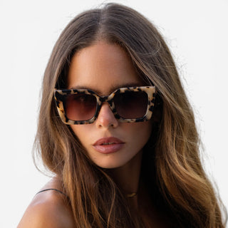 Model wearing FREYRS Coco milky tortoise square sunglasses with brown gradient lenses lifestyle view