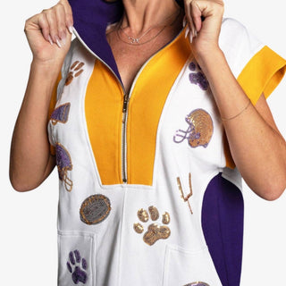 Close-up of Game Day sequin dress featuring purple collar, gold zip neckline and football embellishments