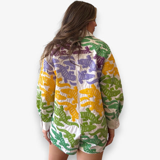 Vibrant alligator-print romper with Queen of Sparkles’ signature bold detailing made for game day fun and standout style.