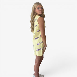 Yellow sequin game day dress with allover purple Geaux lettering, shown in an angled front view.