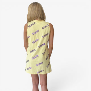 Butter yellow sequin tank dress with allover purple Geaux lettering, styled for tailgates and watch parties, back angled view.