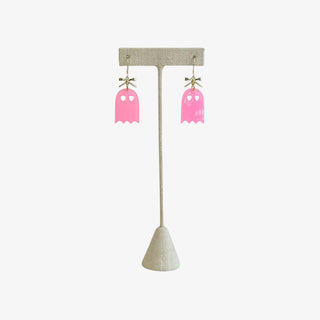 Pink acrylic ghost dangle earrings with gold bow accents, lightweight and festive for Halloween parties or adding a fun seasonal touch.