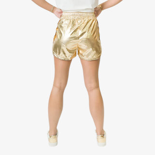 Gold metallic athletic shorts with elastic waistband and curved hemline.