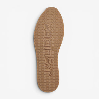 J/Slides Peggy yellow sneaker rubber gum outsole with textured tread shown from the bottom