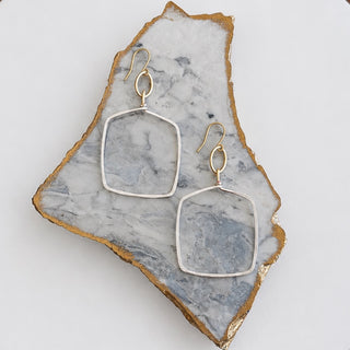 Kitzi two-tone square drop earrings with silver-tone open square frames, gold-tone oval links and fishhook ear wires, front product view