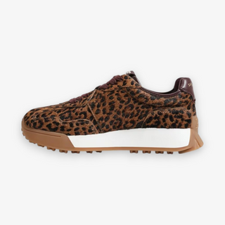 Leopard print sneaker with a white sole on a light gray background