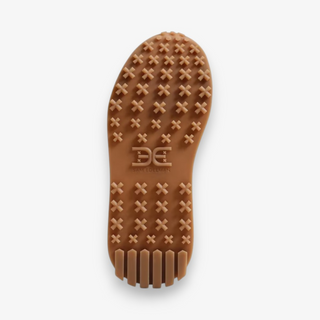 Brown shoe sole with tread pattern on a white background