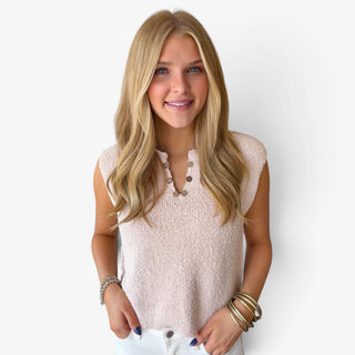 Champagne Marlow button knit top with sleeveless design, textured knit fabric and decorative button neckline, front close-up view.