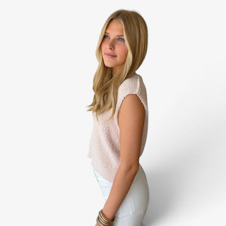 champagne Marlow button knit top with sleeveless shoulders, relaxed fit and textured knit fabric, side view