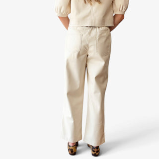 Melissa Nepton Gustave cream faux leather trouser on model showing wide leg fit and back pockets