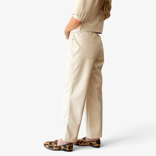 Melissa Nepton Gustave cream faux leather wide leg trouser on model, side view showing relaxed fit