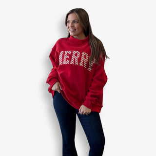 Woman wearing a red sweater with white text on a plain background