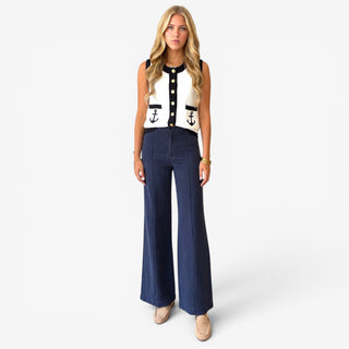 Michael Stars April linen trouser in Nocturnal navy styled with an ivory nautical knit vest, full-length front view