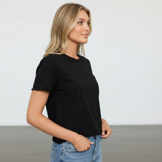 Michael Stars Jackie Black Tee short sleeve black crew neck top styled with jeans, side profile view