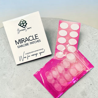 Brianna Cannon Miracle Earlobe Patches with translucent support patches and storage pouch for repairing stretched or torn earlobes.