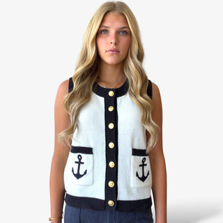 Ivory nautical knit vest with navy trim, gold button front and anchor pocket details, close front view