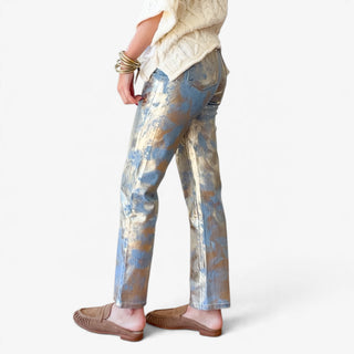 Nerissa metallic straight leg jeans with gold foil accents on blue denim, showing the straight silhouette, back pocket and ankle-length hem, side view.
