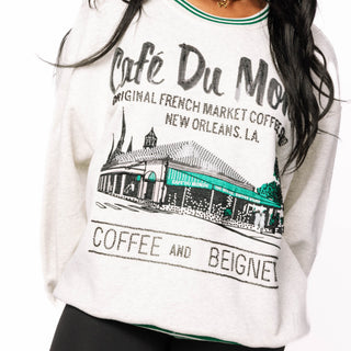 Queen of Sparkles grey Café Du Monde sweatshirt with green sport-stripe neckline and sequin graphic.