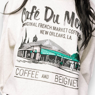 Queen of Sparkles grey Café Du Monde sweatshirt with green sport-stripe neckline and sequin graphic.