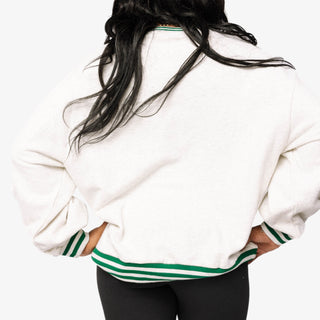 Queen of Sparkles grey Café Du Monde sweatshirt with green sport-stripe neckline and sequin graphic.