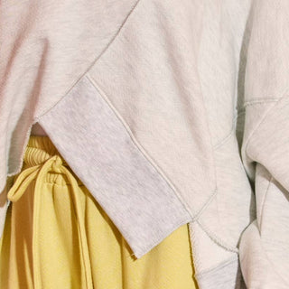 asymmetric hem sweatshirt heathered grey close up angled hem detail