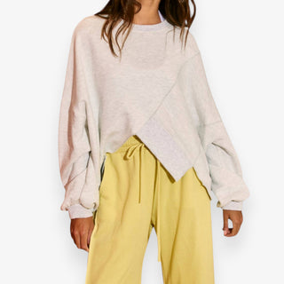 oversized asymmetric hem sweatshirt heathered grey front view styled with yellow pants
