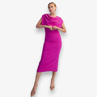 Woman wearing a bright pink dress on a white background