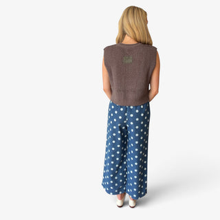 Polka dot denim wide leg pants in blue with white dot print and relaxed silhouette, back view