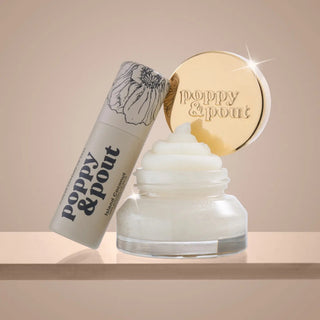 Poppy & Pout Island Coconut Lip Care Duo with coconut lip balm and open lip scrub jar with gold lid on neutral background