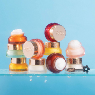 Poppy & Pout moisturizing lip mask collection featuring Wild Honey and assorted lip treatment jars