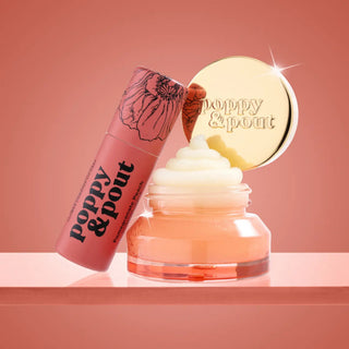 Poppy & Pout Pomegranate Peach Lip Care Duo with lip balm and open exfoliating lip scrub jar against coral background